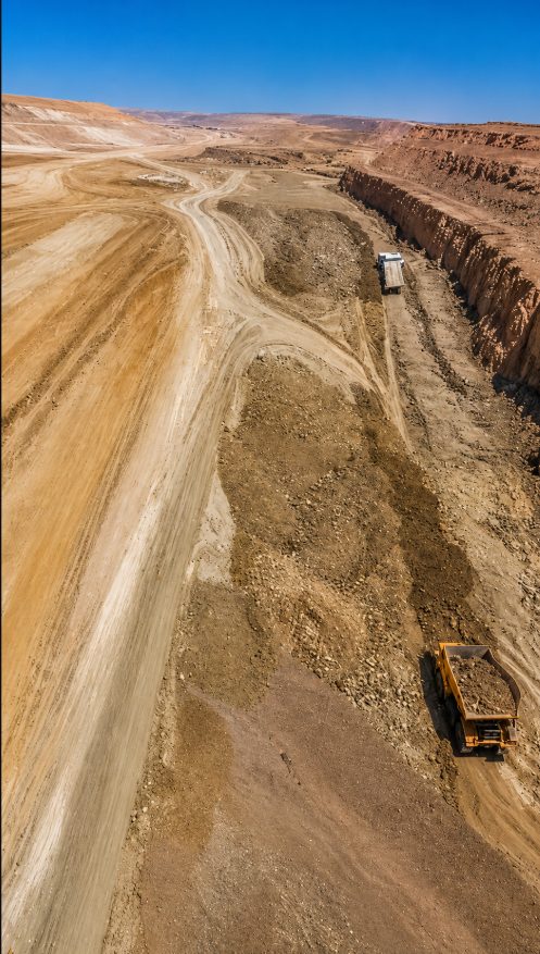 Aerial view of a haul truck on the quarry access road